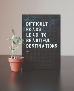 Sign saying "Difficult roads lead to beautiful destinations"